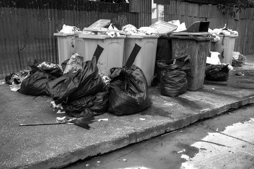 Dalston street with recycling bins and commercial storefronts
